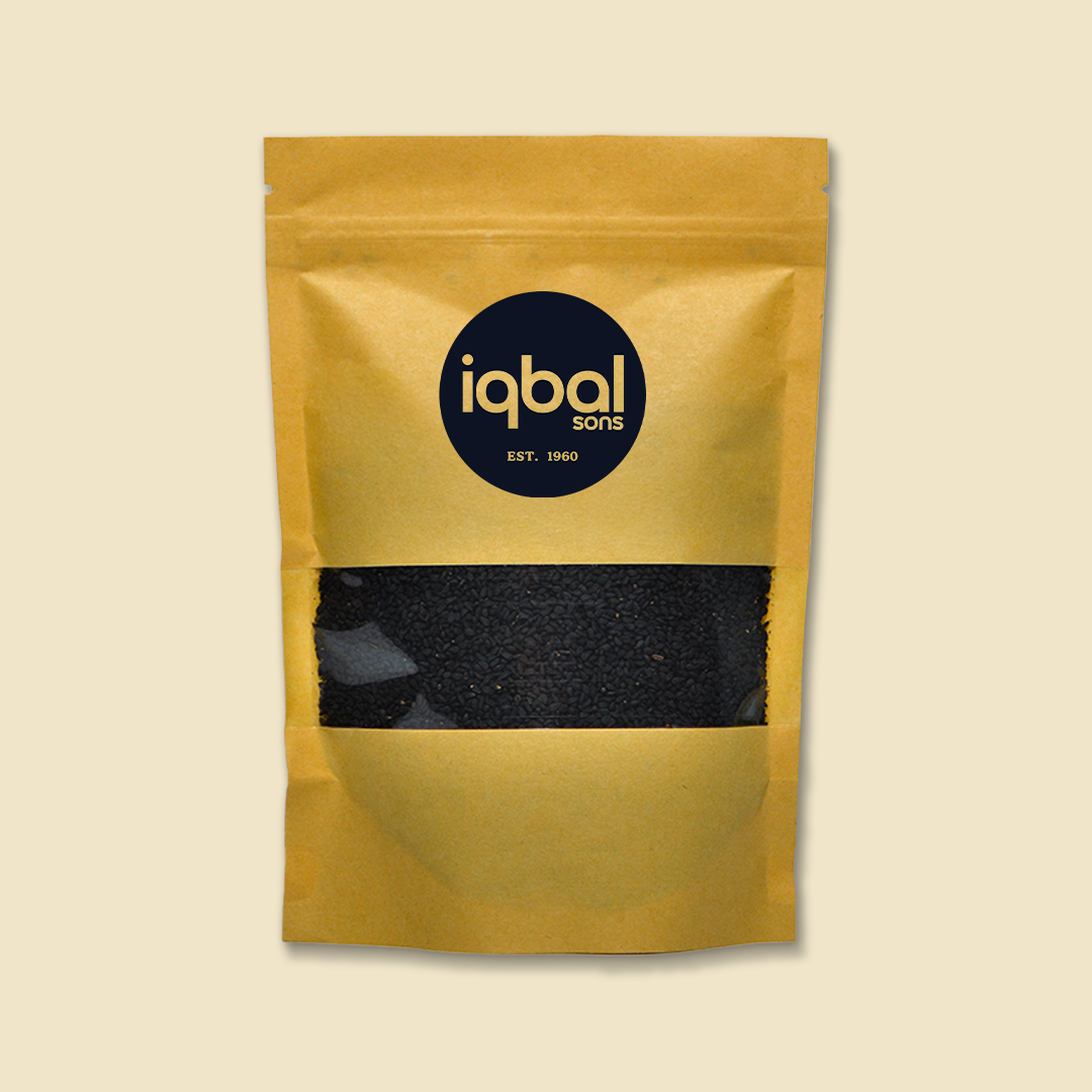 Yellow packaging containing Black Cumin with 'iqbal Sons' branding on a beige background